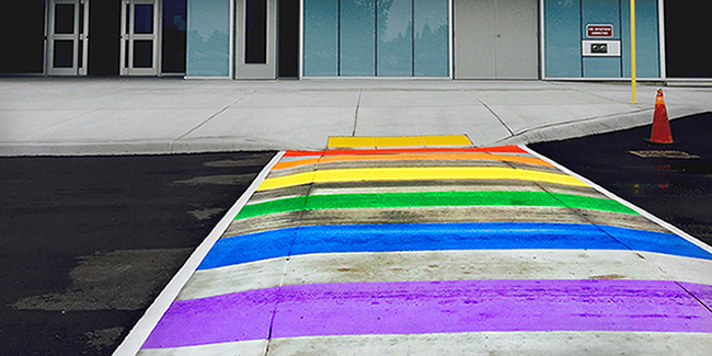 Ground level view of rainbow pride crosswalk at London Campus
