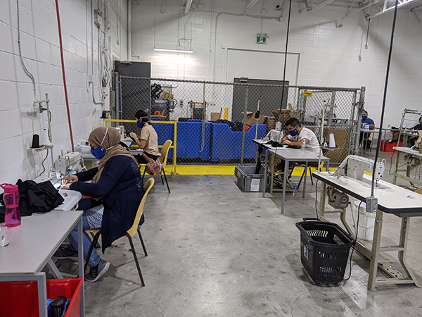 Workers manufacture "The Worker" face masks through a joint research project by Goodwill Industries and Fanshawe College’s Centre for Research and Innovation