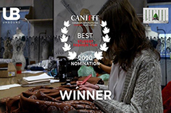 Female student sewing garment with film festival logo overtop