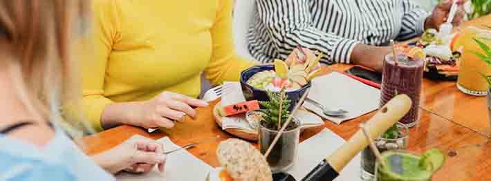 Women enjoy healthy vegan brunch