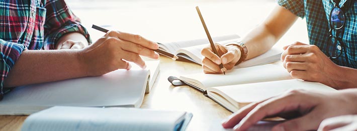 College students studying and reading together