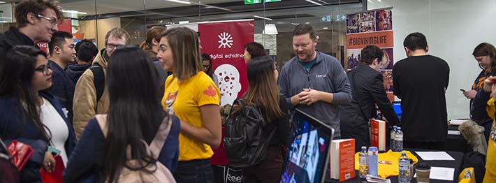 Students and industry leaders at a networking event