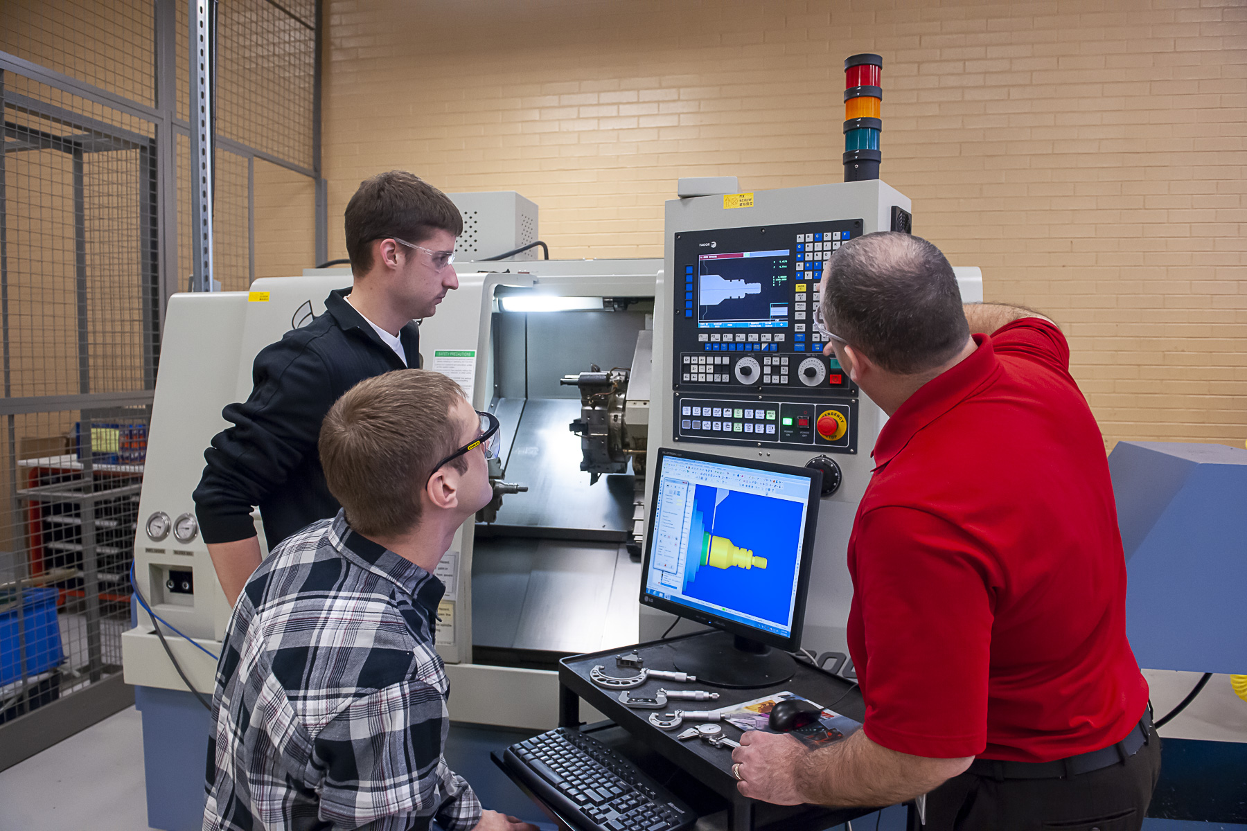 Faculty member educating students within the manufacturing engineering technology program 