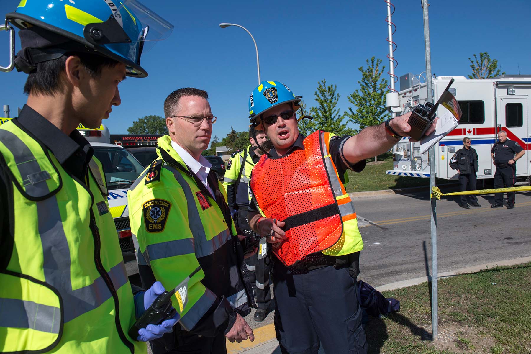 Emergency Management student consults with team members 