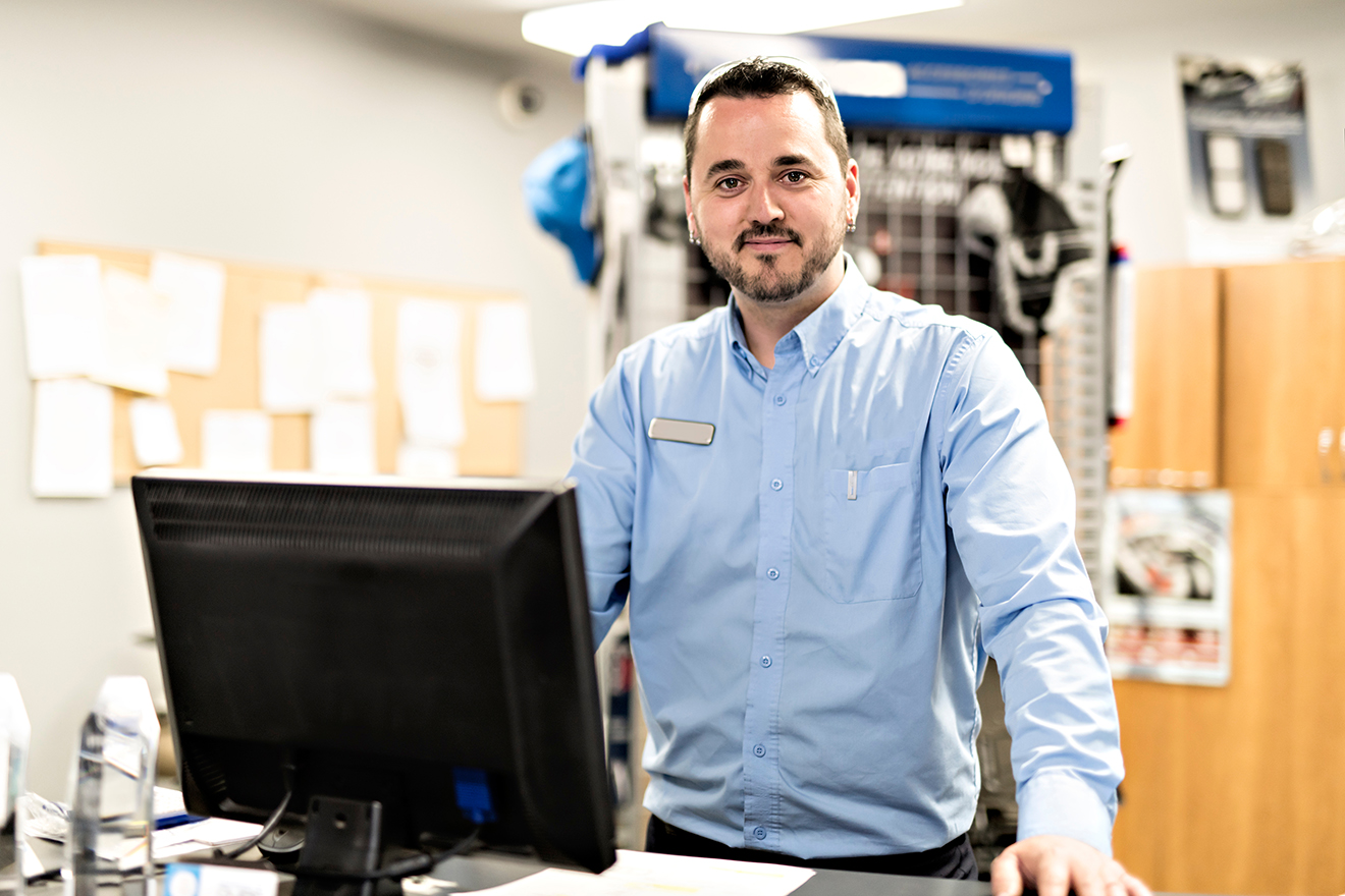Employee behind a service desk