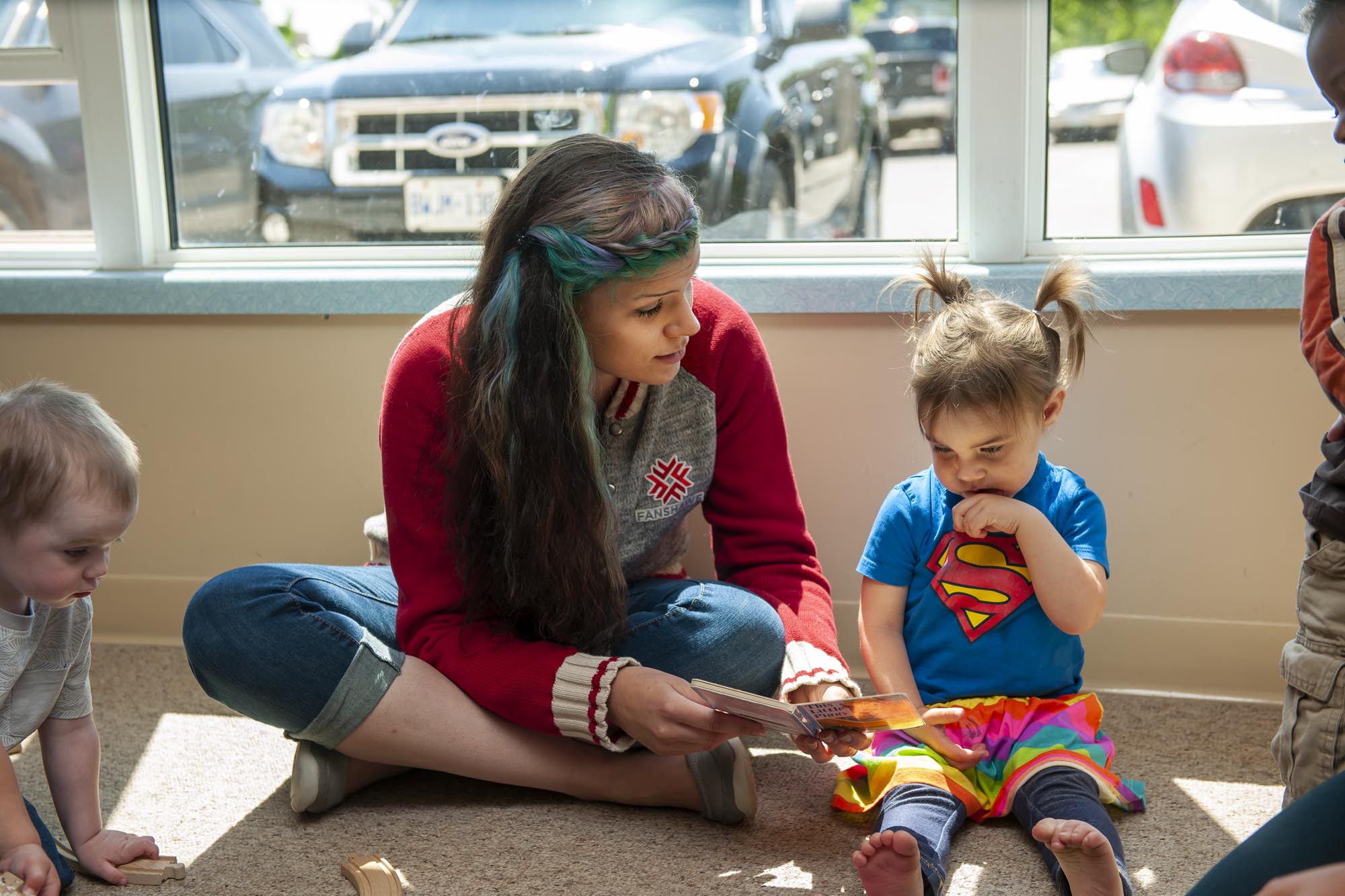 Fanshawe student working with toddler in daycare setting