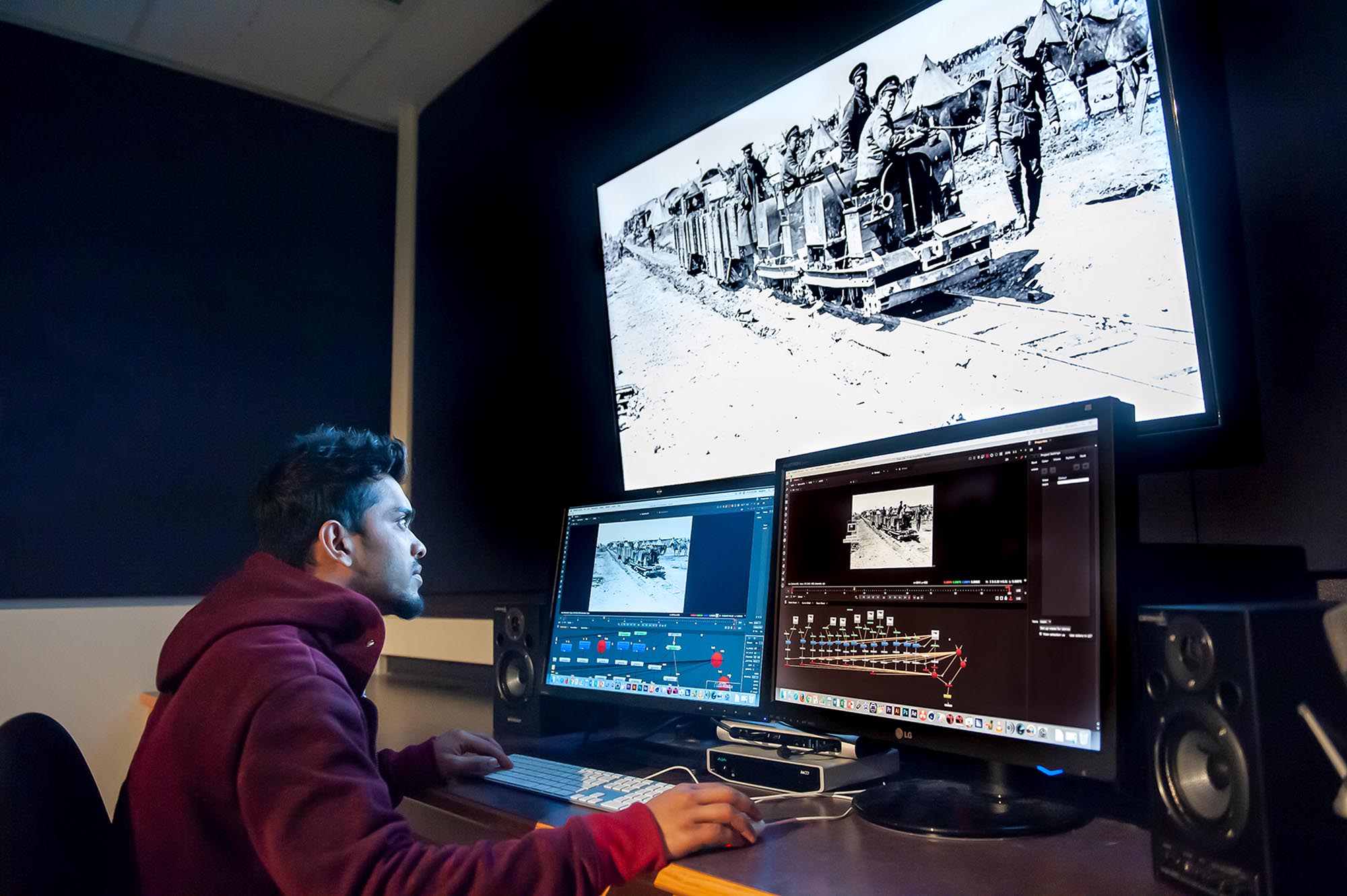 Student working on adding in visual effects to video in lab