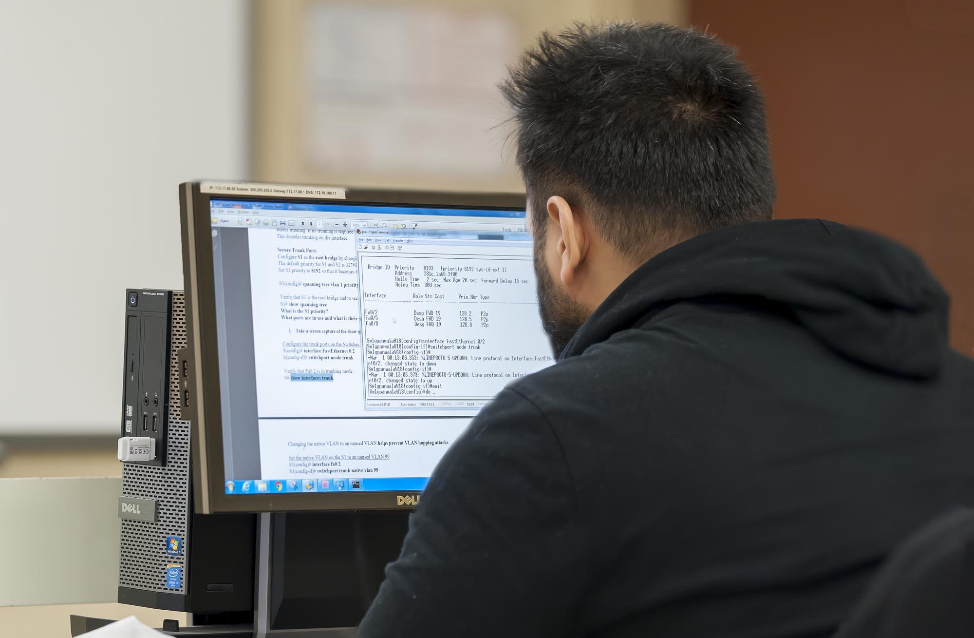 Information Security Management student working on computer in classroom lab