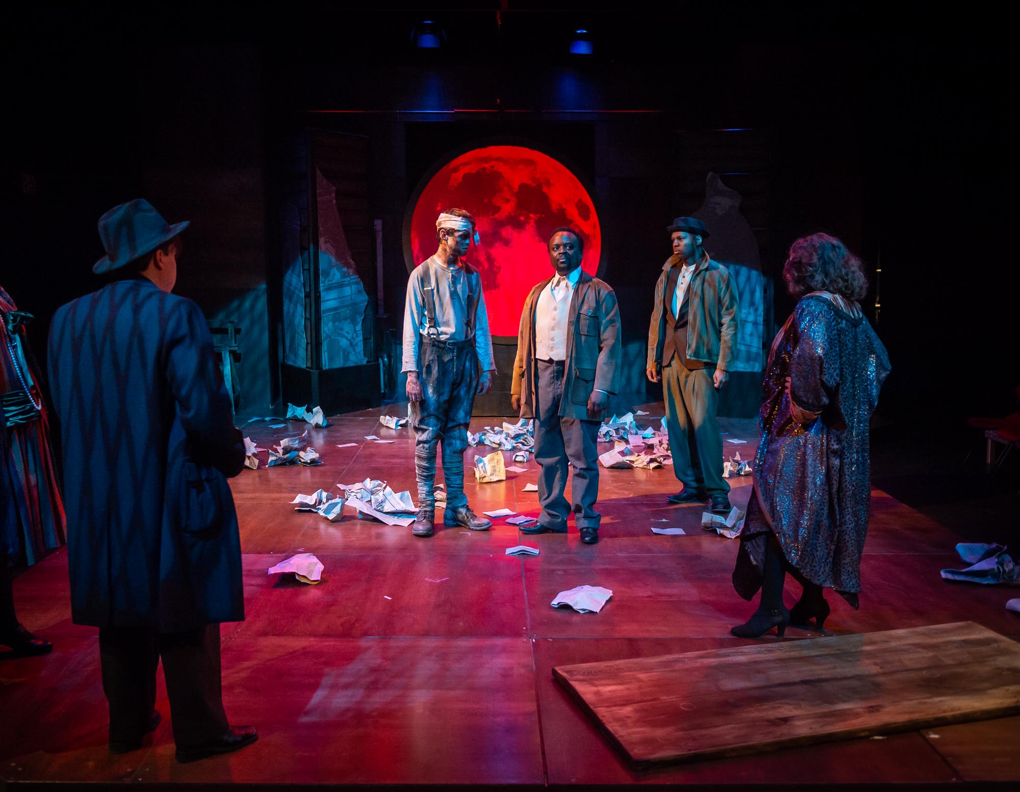 Theatre Arts students, acting on stage in Drums in the Night play