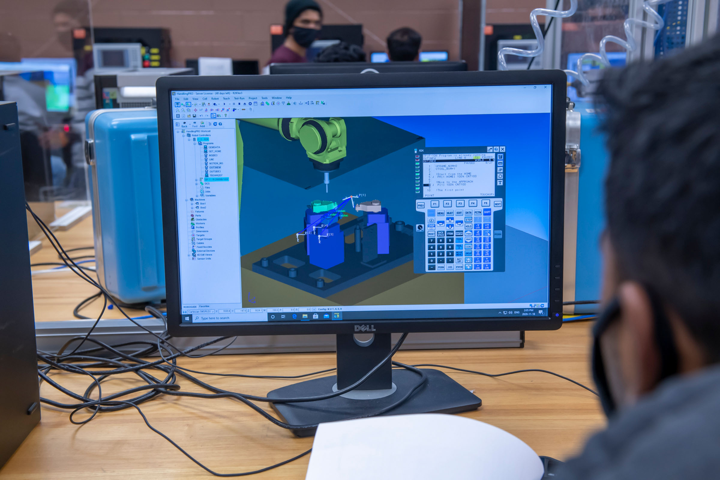 Student looking at computer with 3d render