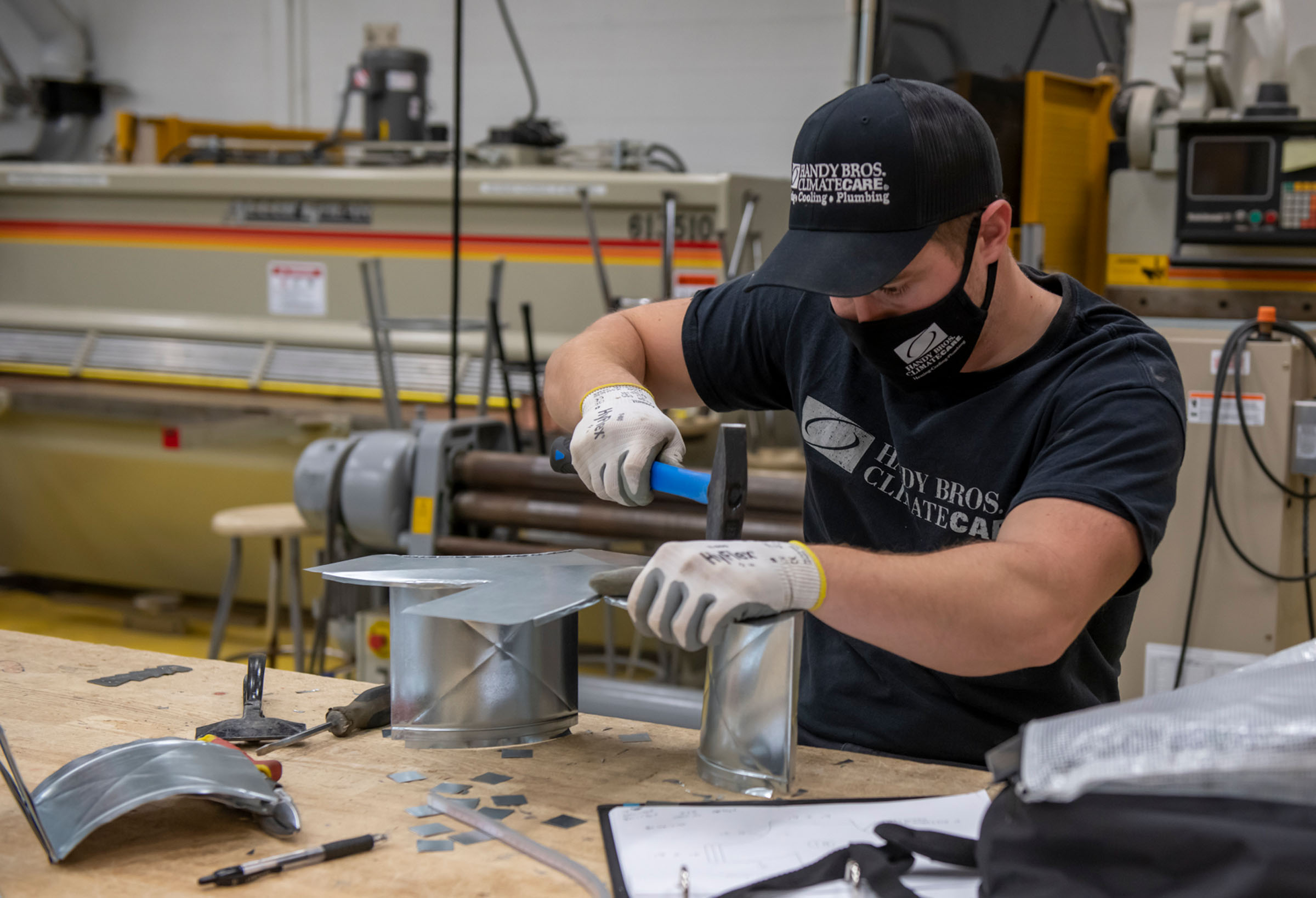 Student working on sheet metal
