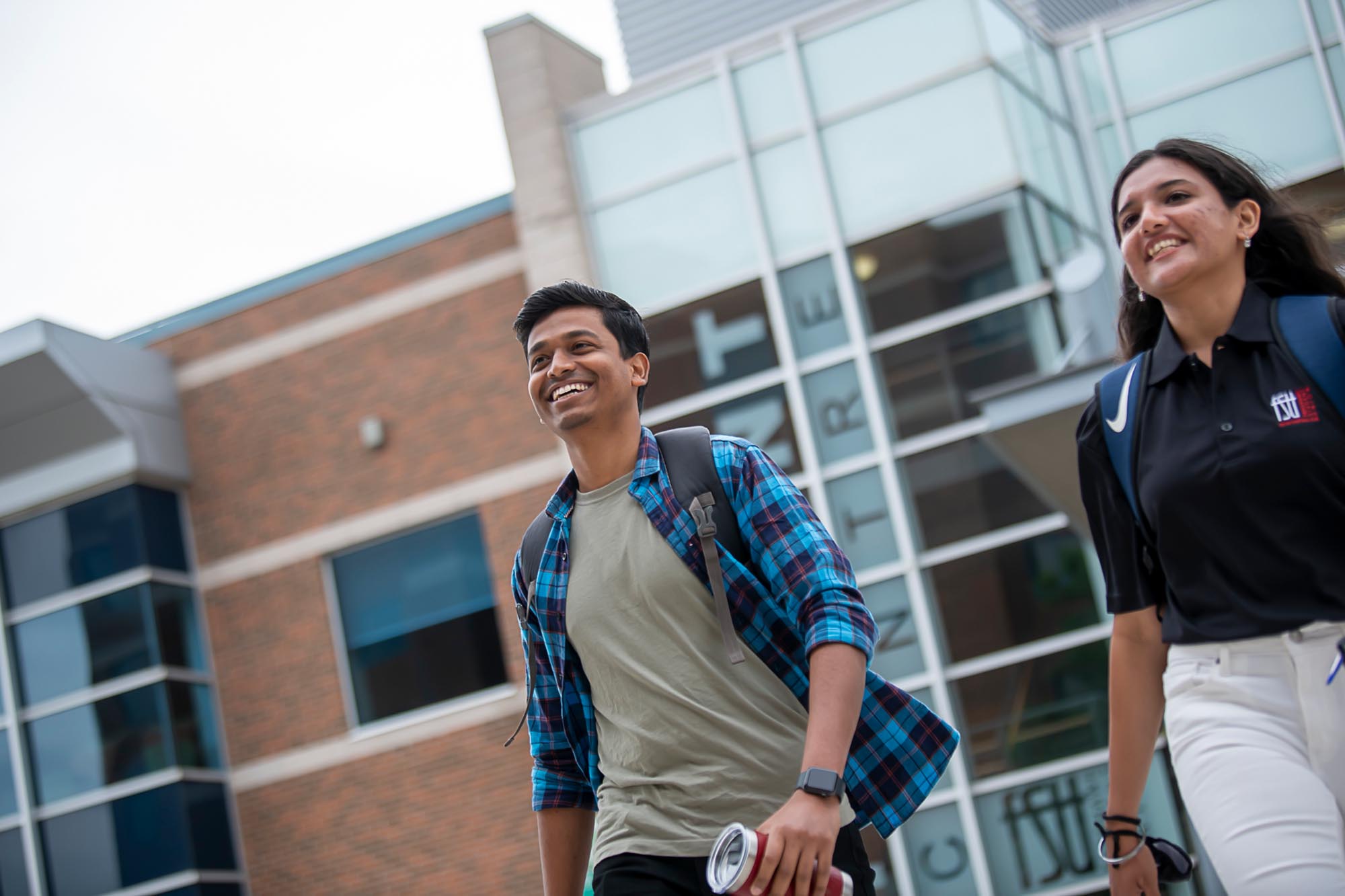 Two students walking outside