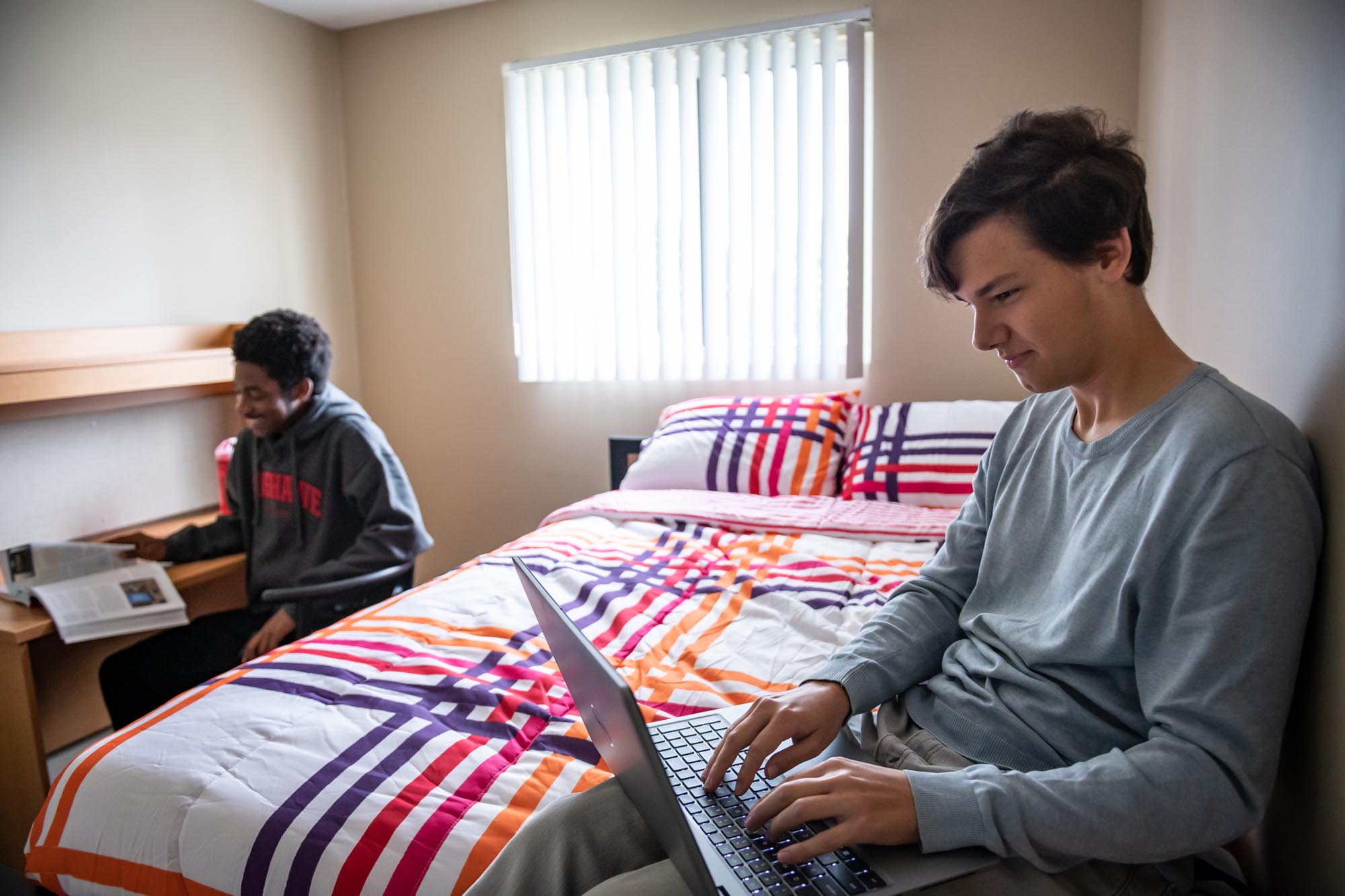 Two guys hanging out in residence room