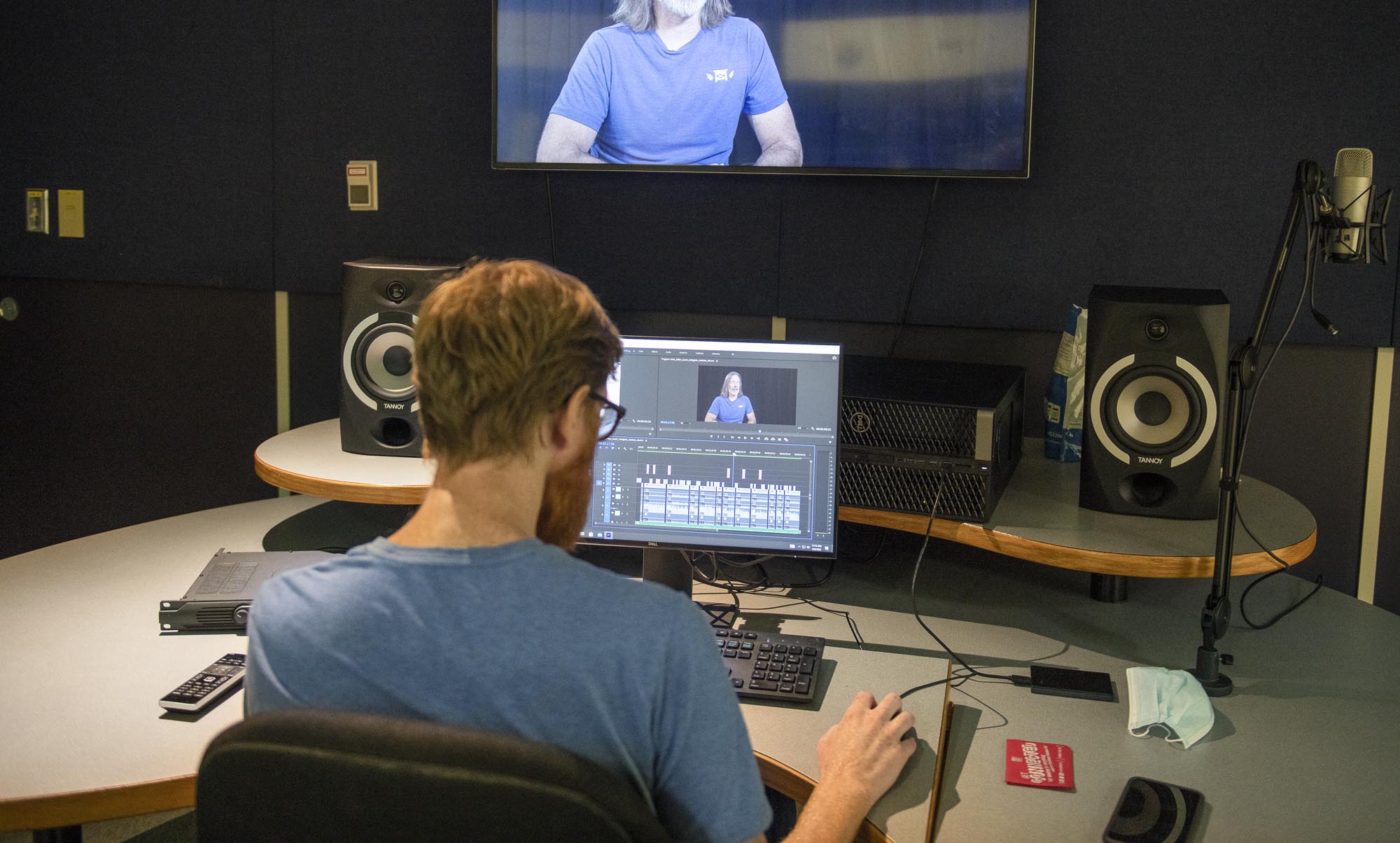 Broadcasting - Television and Film Production student editing video in studio