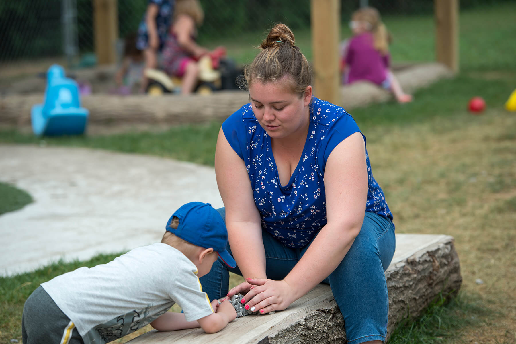 ECE worker playing with children