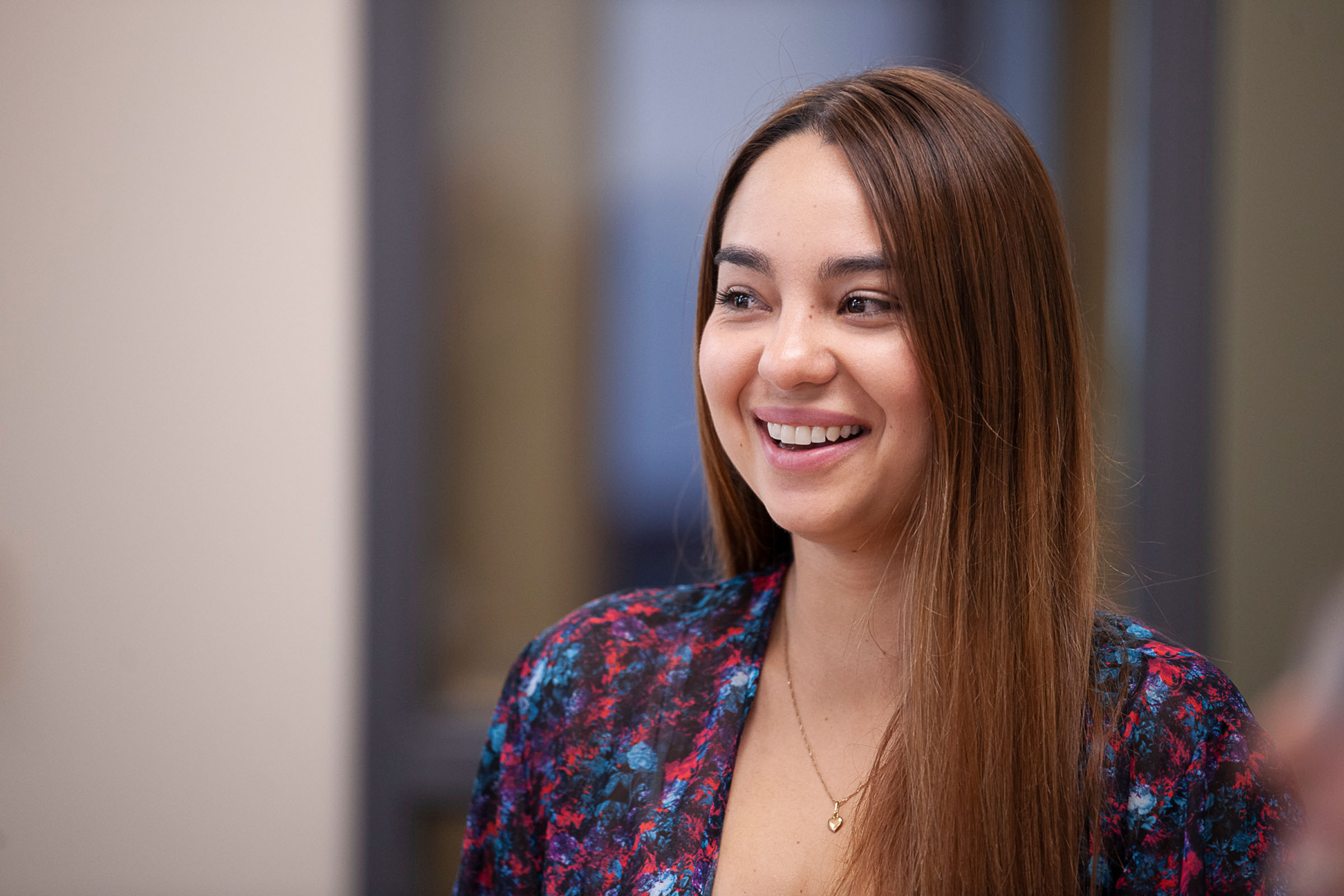 Girl smiling and looking past the camera