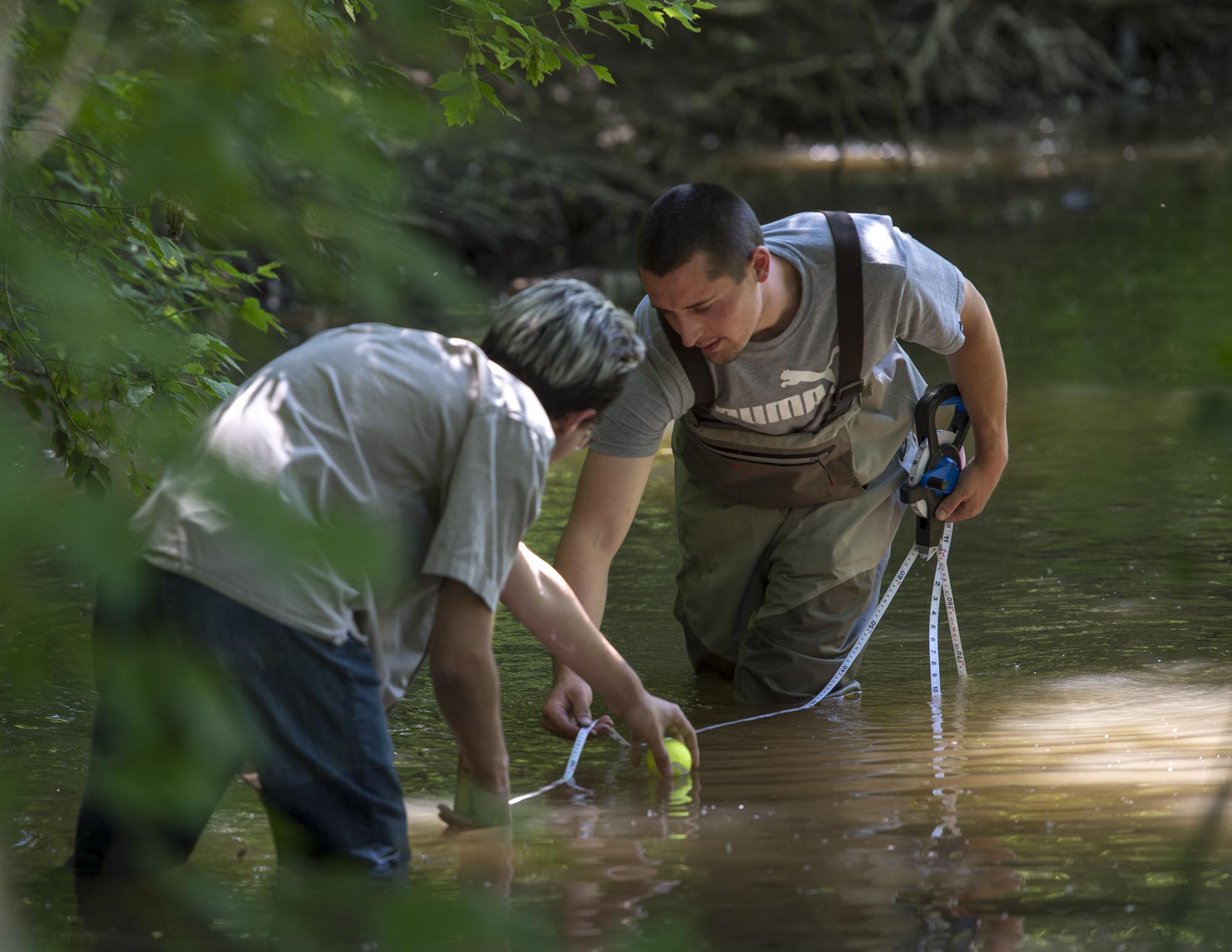 Two Environmental Technology students, taking samples in Stoney Creek