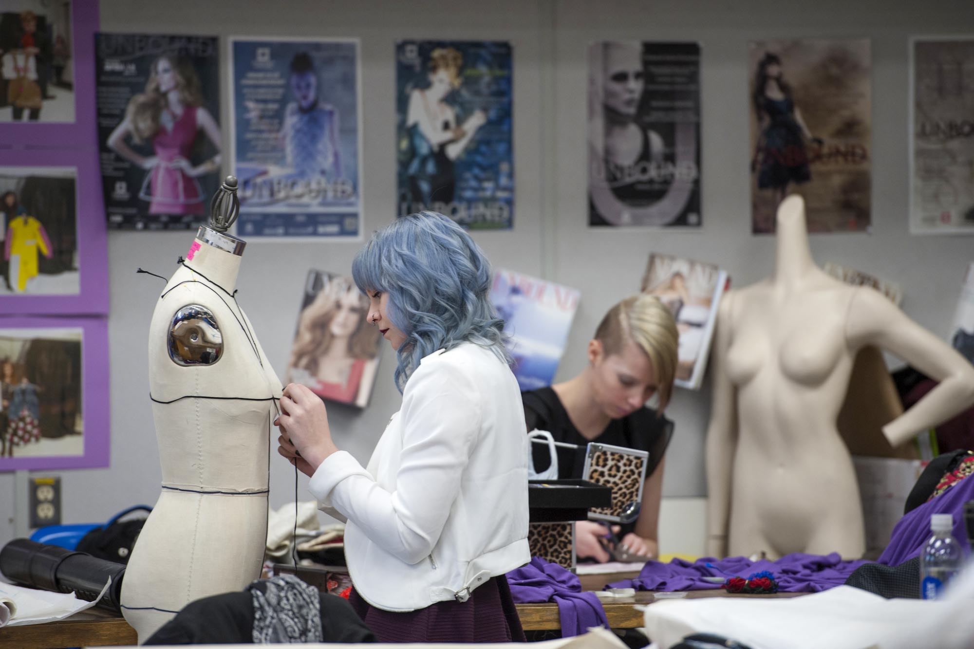 Fashion Design student working on project in design studio