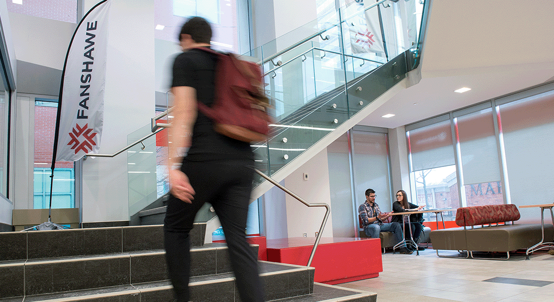 Student walking up stairs