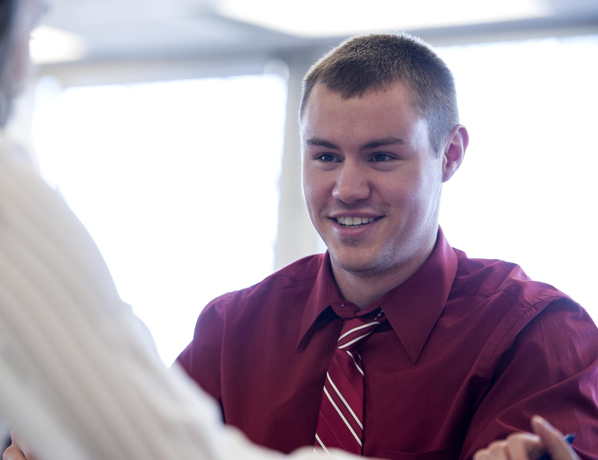 Business student smiling in classroom setting