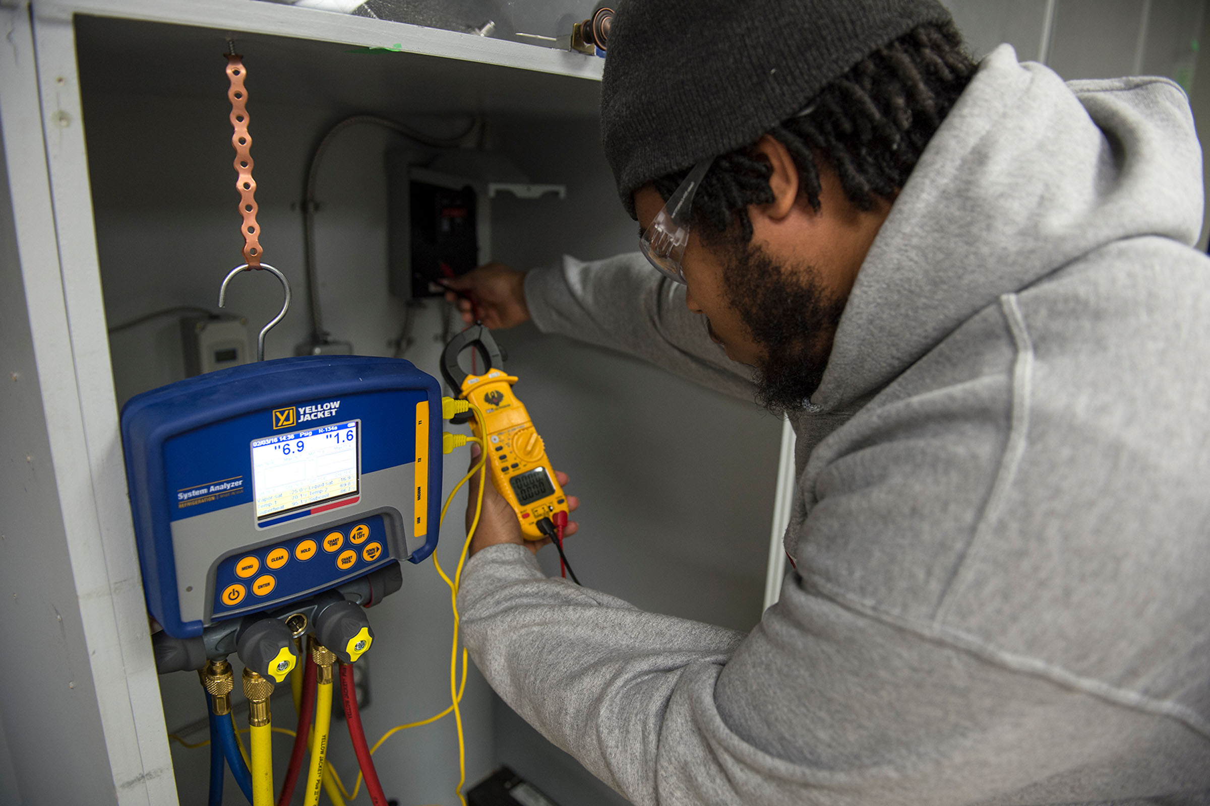 Student working on HVAC system
