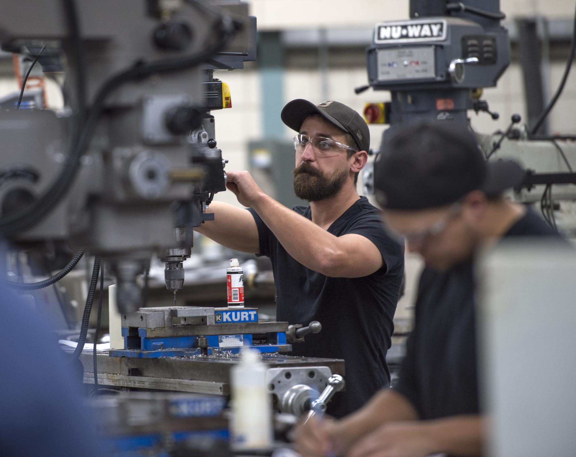 Student working on equipment in machining lab
