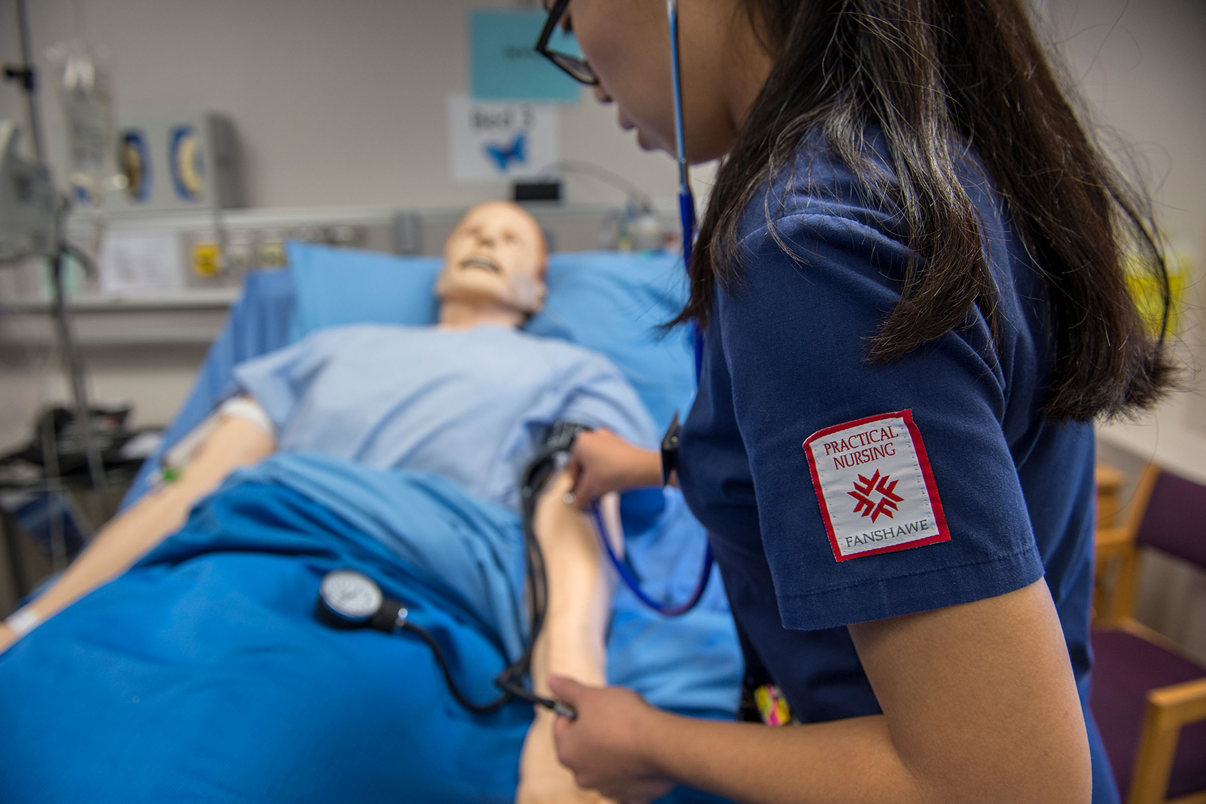 Nursing student working on dummy patient