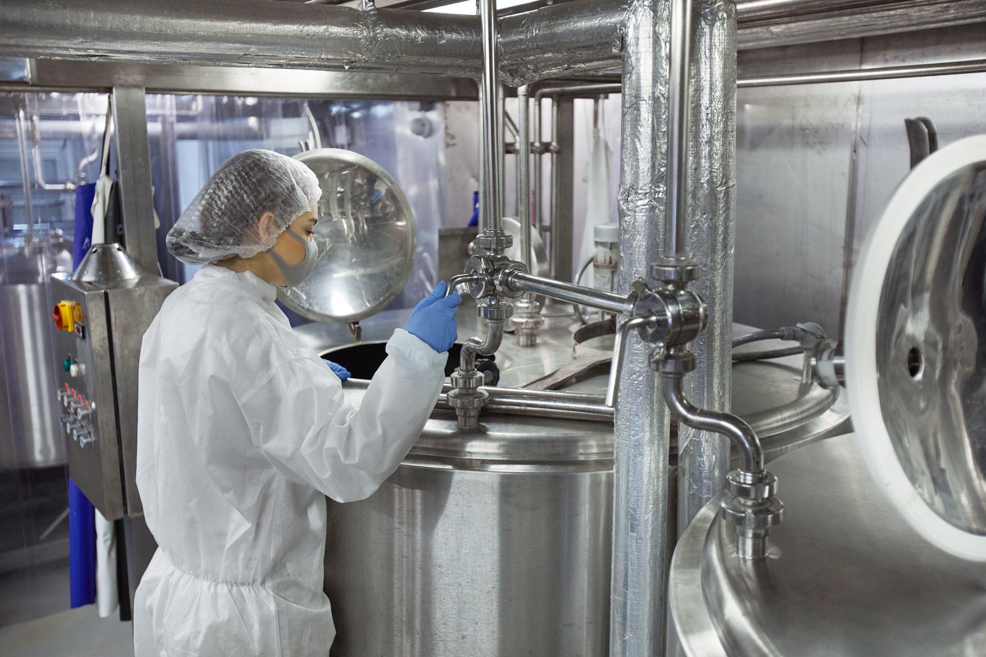 Person looking at gauges in food processing facility