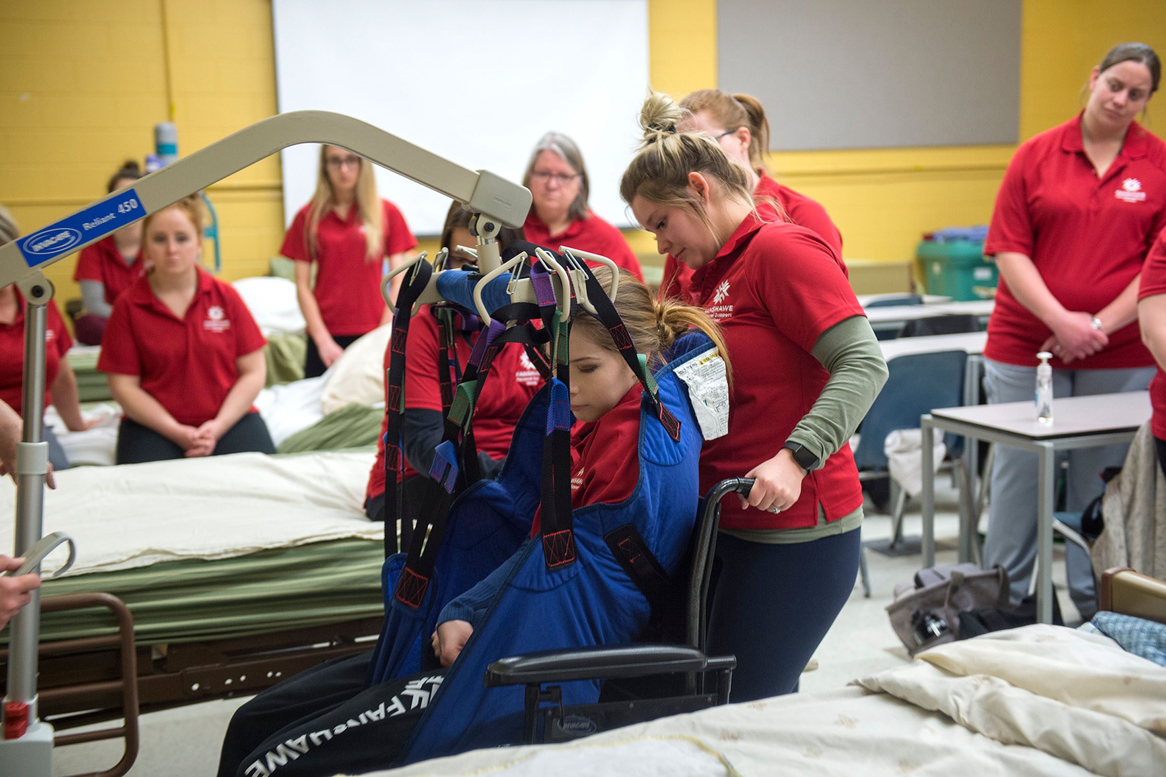 Students practicing with patient transportation device