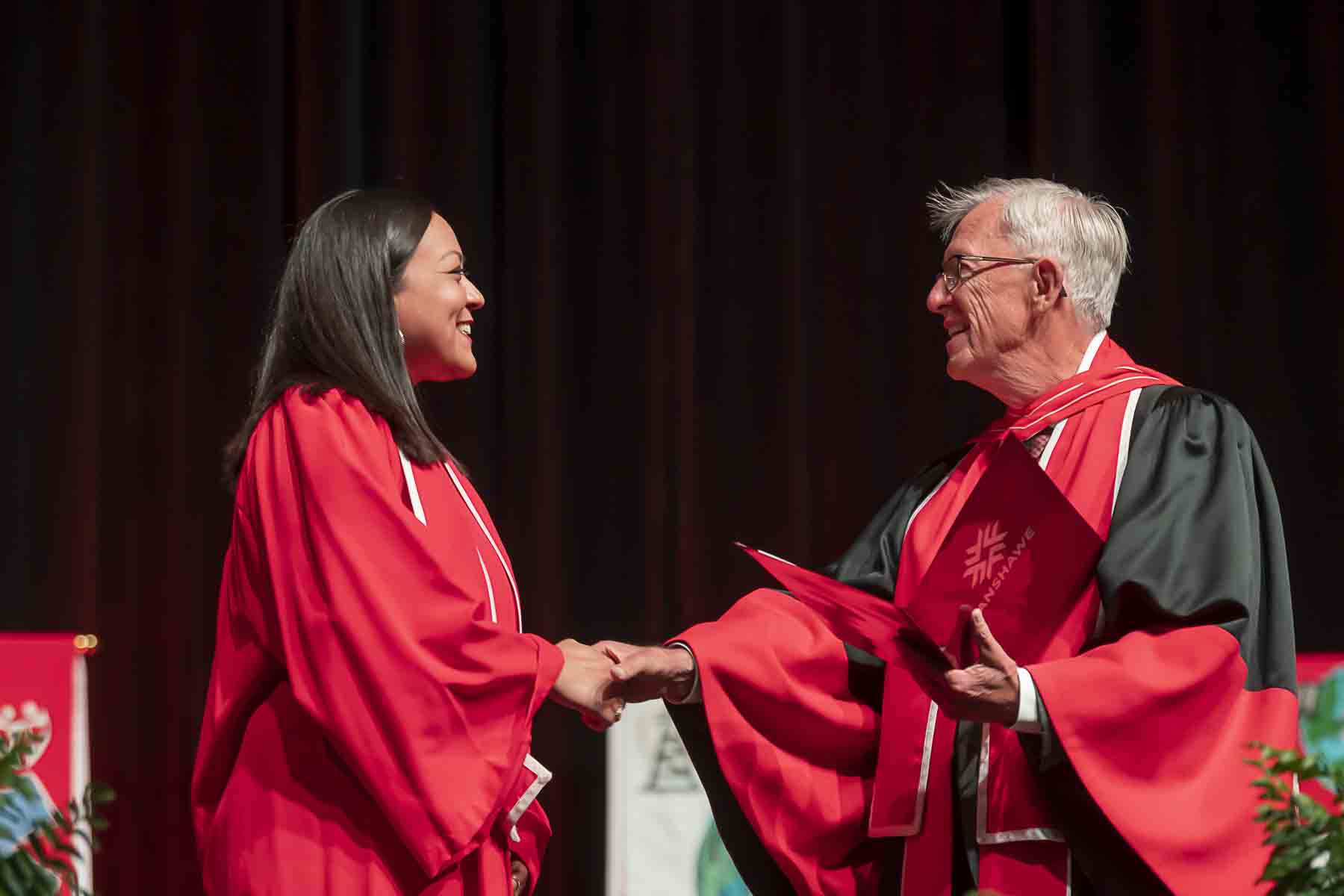 Student accepting diploma on stage at graduation