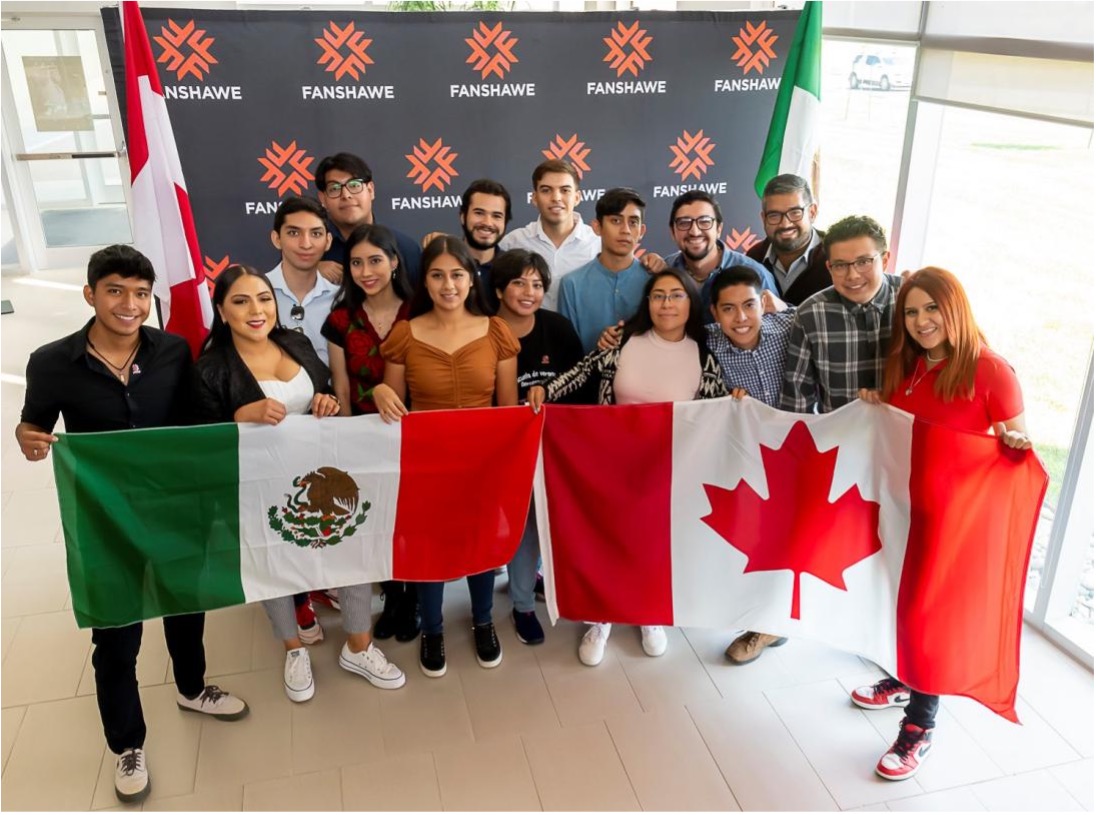 Students from Mexico holding up Mexico and Canada Flag