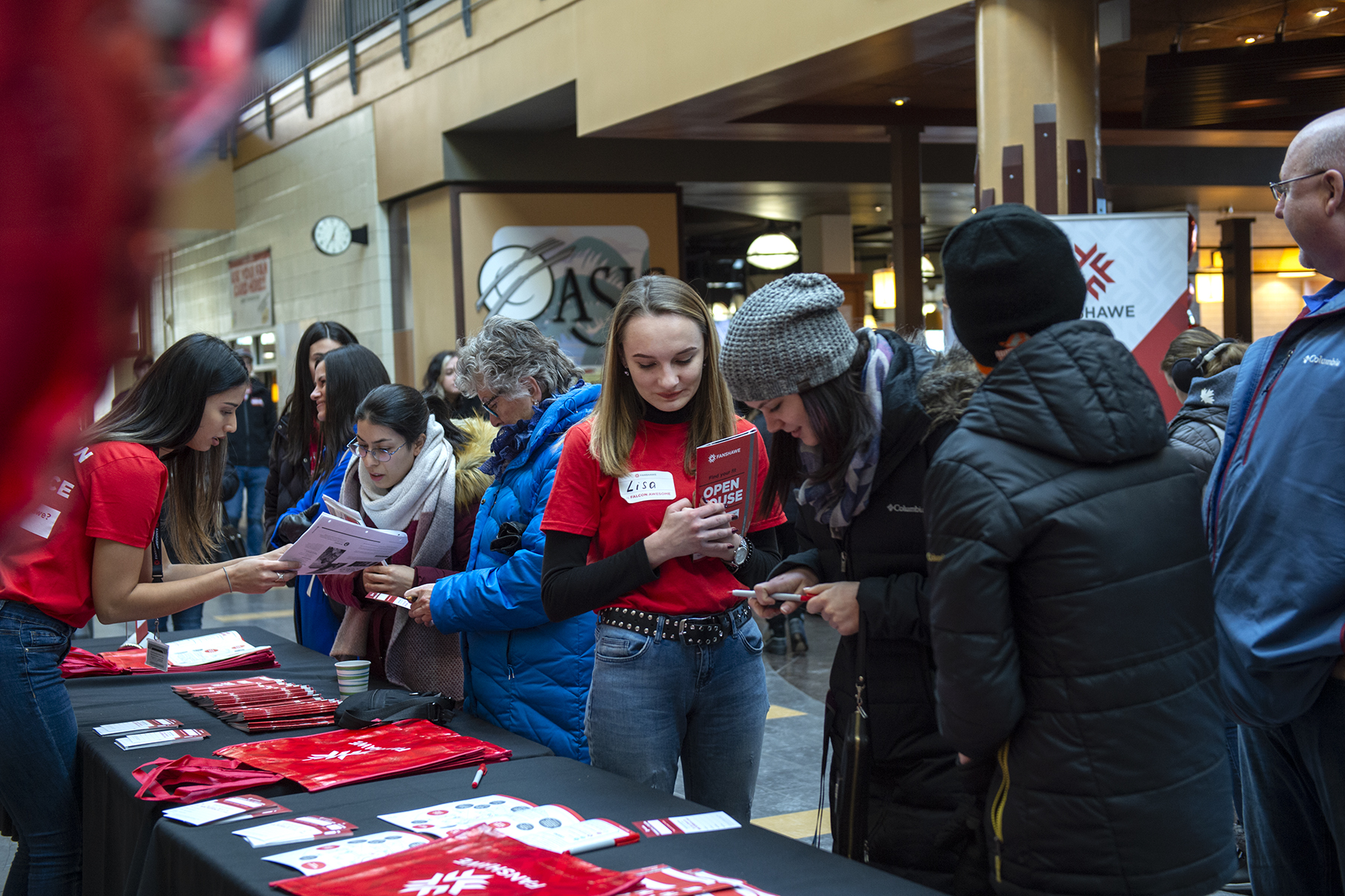 Fanshawe open house with student reviewing fanshawe residence