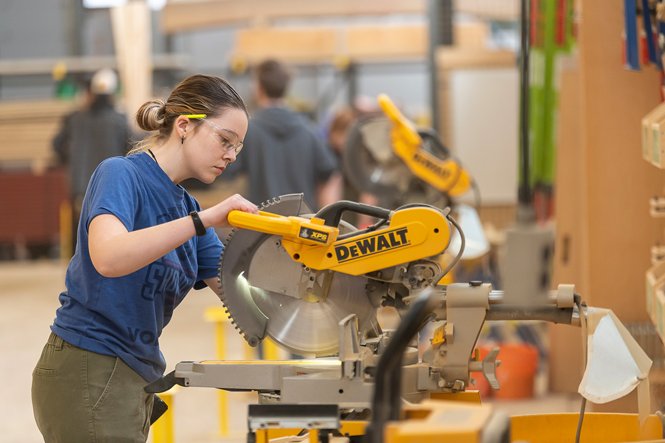 Fanshawe student using a chop saw
