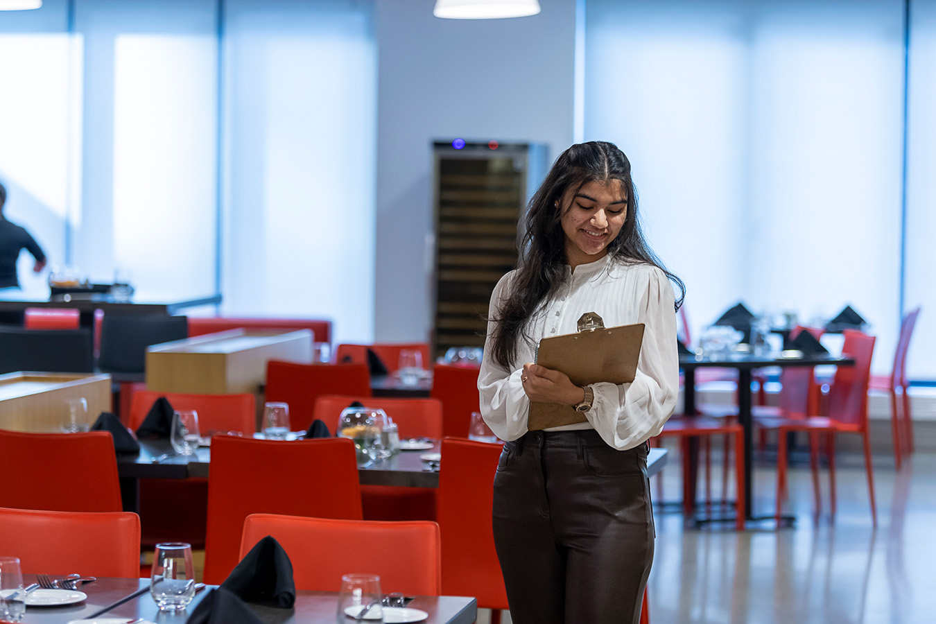 Photo of a Nutrition and Food Service Management student at Chef's Table Restaurant