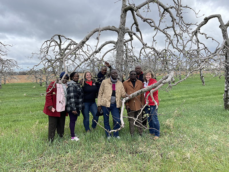 Members of the Kenyan delegation planting an Eastern Redbud.