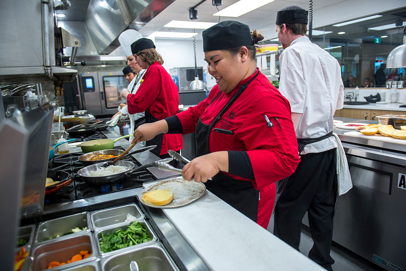 Photo of a culinary student working in the kitchen