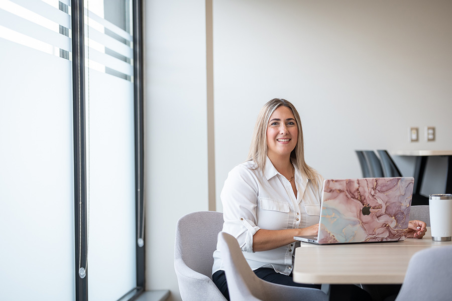 Photo of a student sitting at a desk