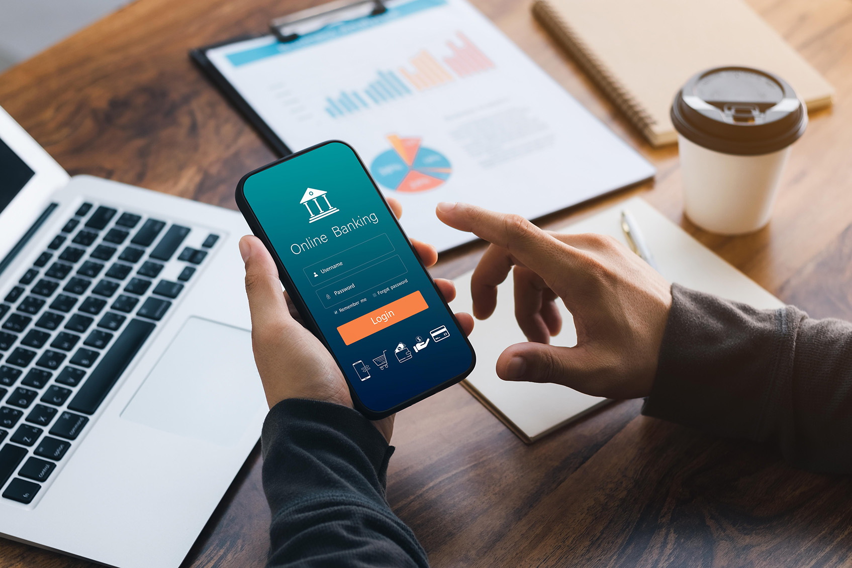 Person opening a mobile banking app on their mobile devices