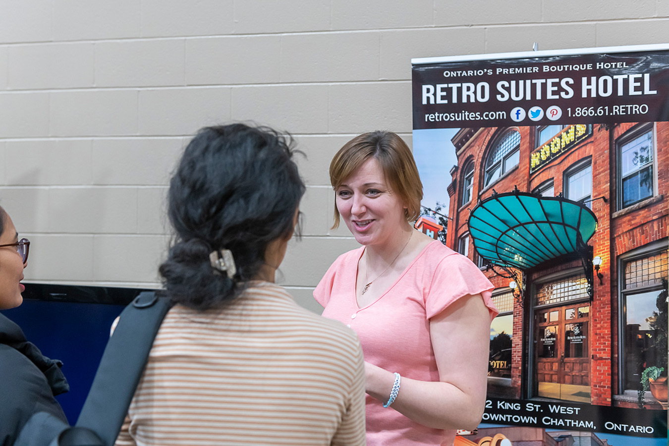 Students speaking with an employer at the job fair