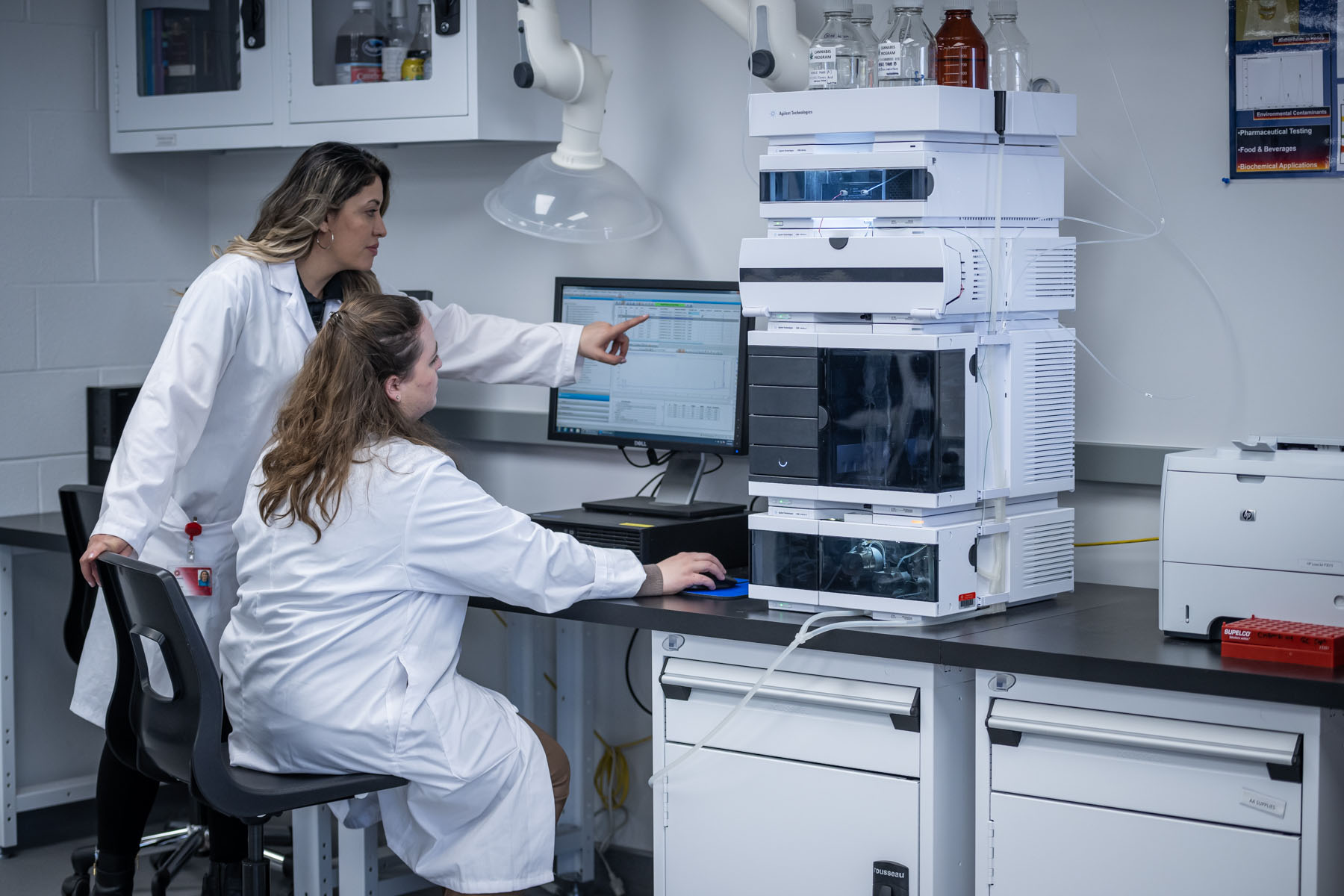 Researchers examining their findings on a computer