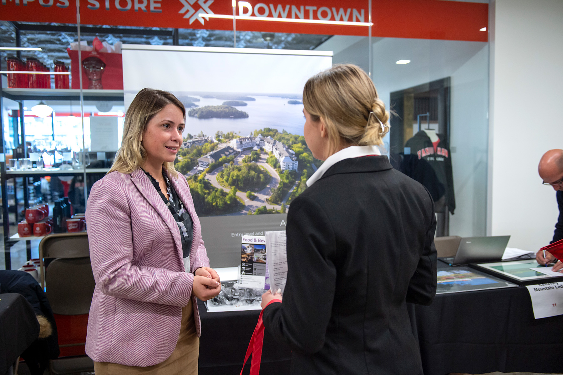 Photo of a Fanshawe student speaking with an employer