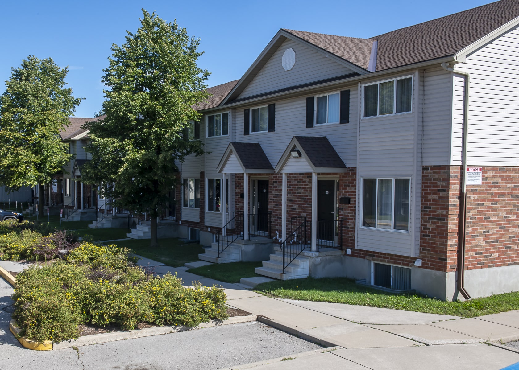 side of townhouse and front lawn