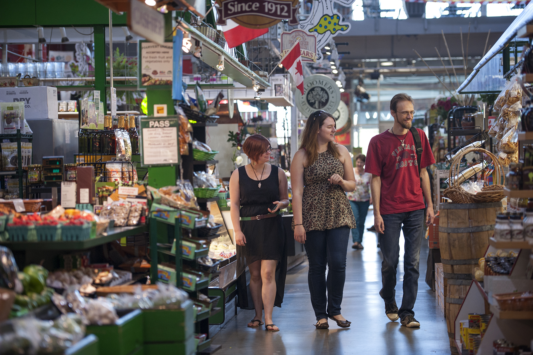 A group of people walking in the market