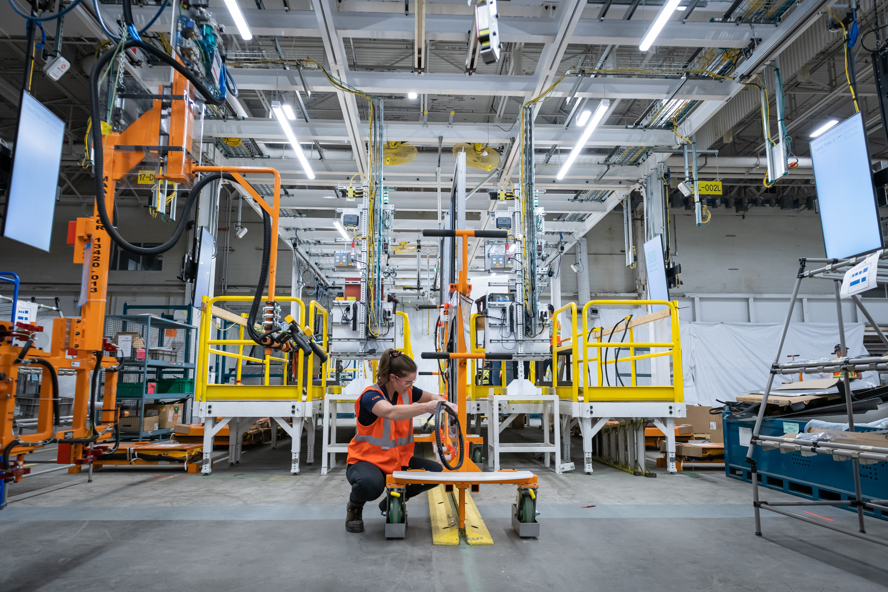 Photo of a technician working at a GM factory