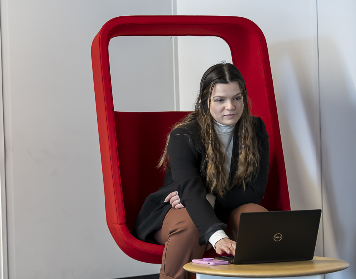 A female marketing student studying on her laptop