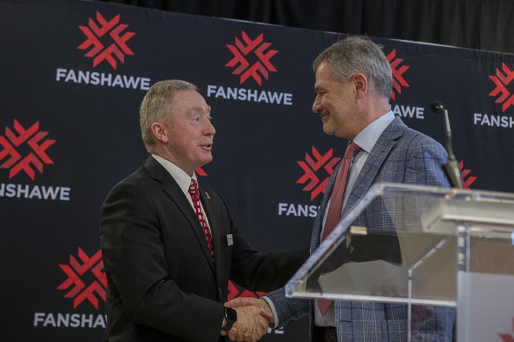 Photo of President Devin shaking hands with Jamie Crich