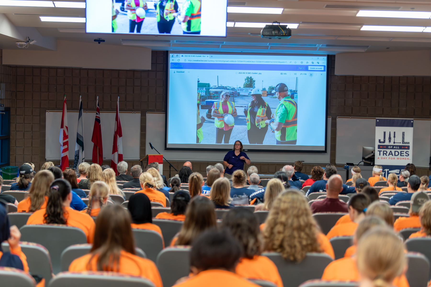 90 high school students listen to a guest speaker at Jill of all Trades event.