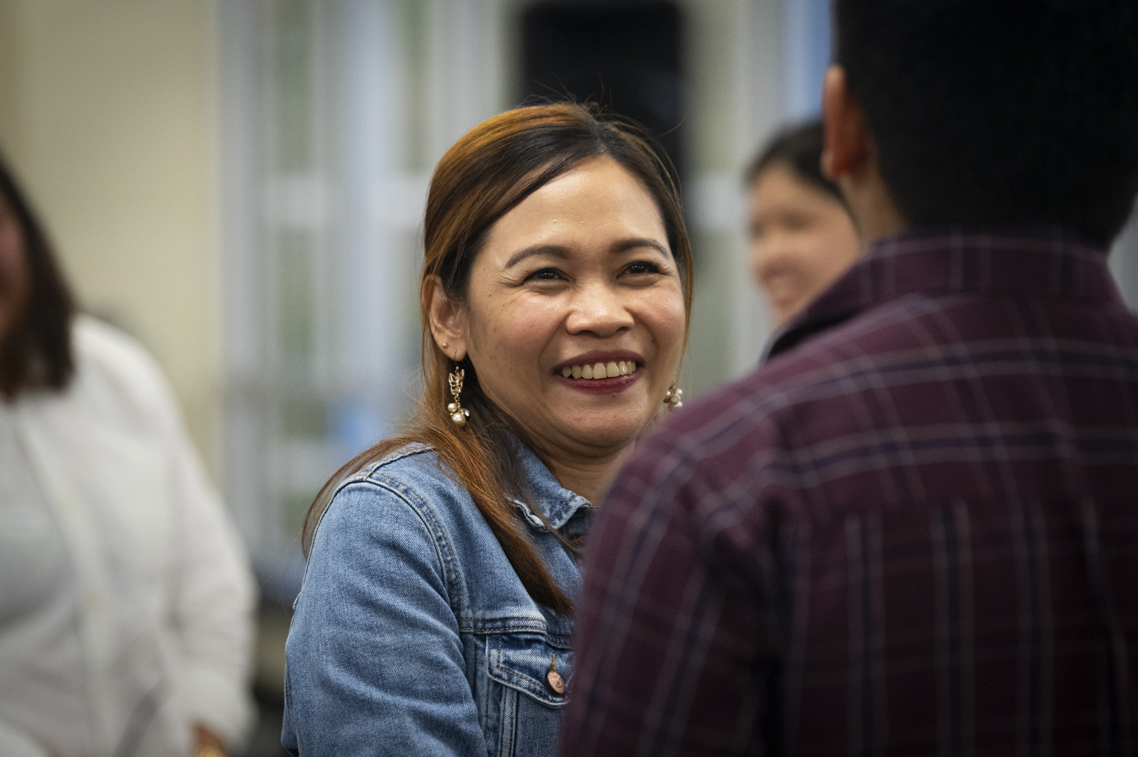 A female student networking at a Supply Chain Management event