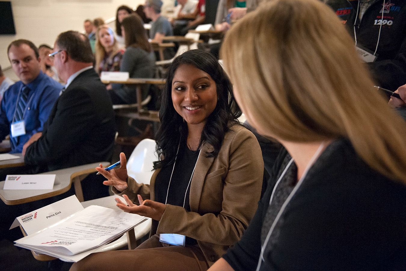 Photo of a student speaking with a mentor at the mentorship fair