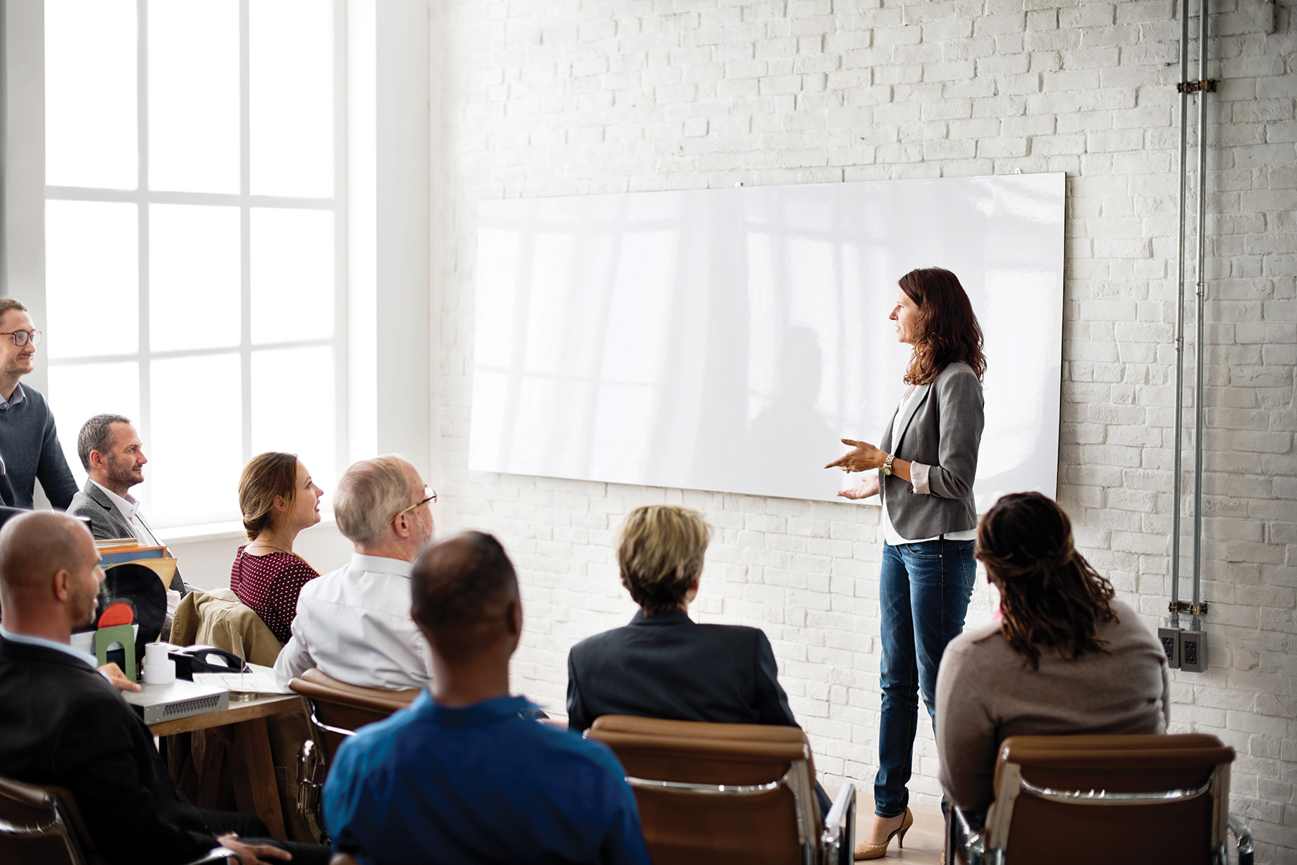 Photo of an employee giving a presentation 